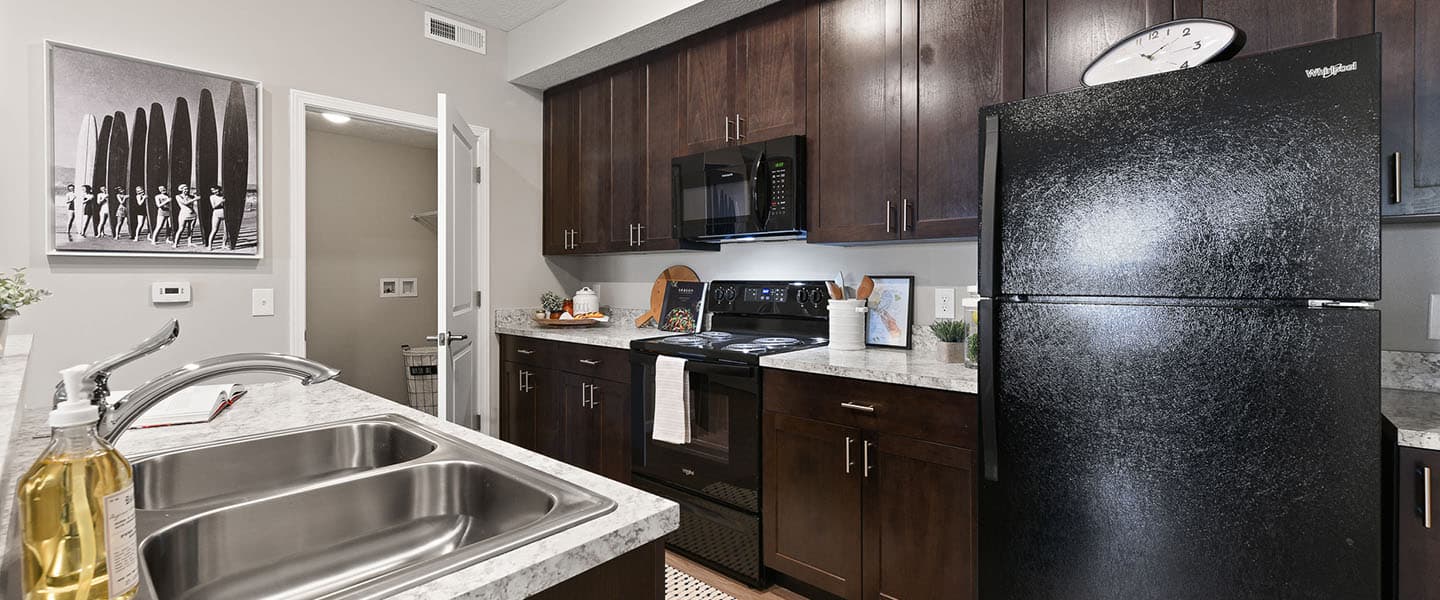 An open kitchen layout complete with updated appliances and modern decor.