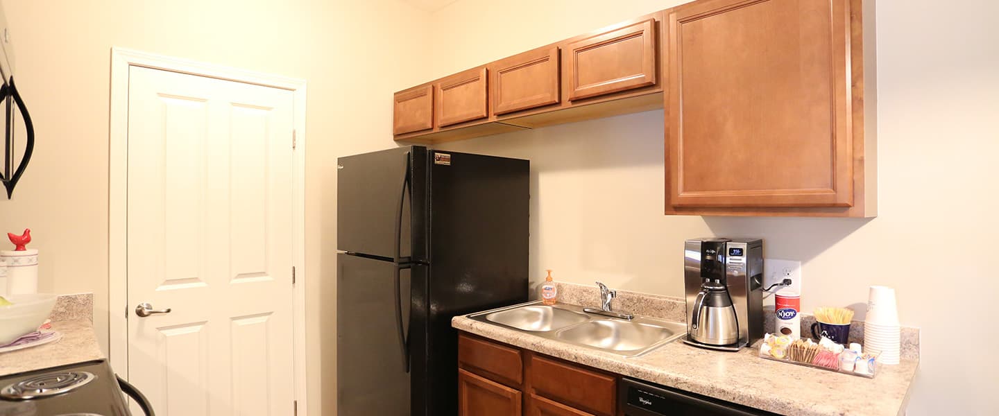 An open kitchen layout complete with updated appliances and modern decor.