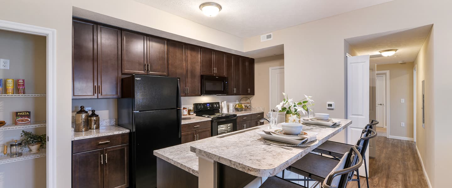 An open kitchen layout complete with updated appliances and modern decor.