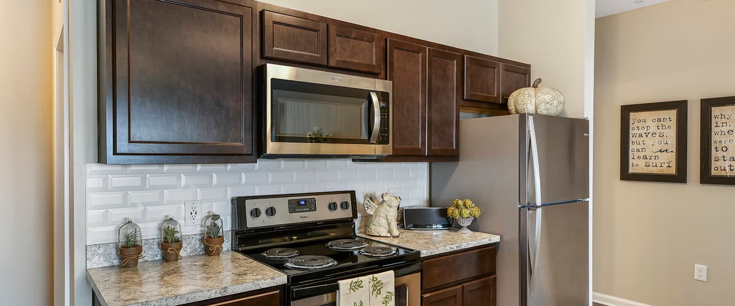 An open kitchen layout complete with updated appliances and modern decor.
