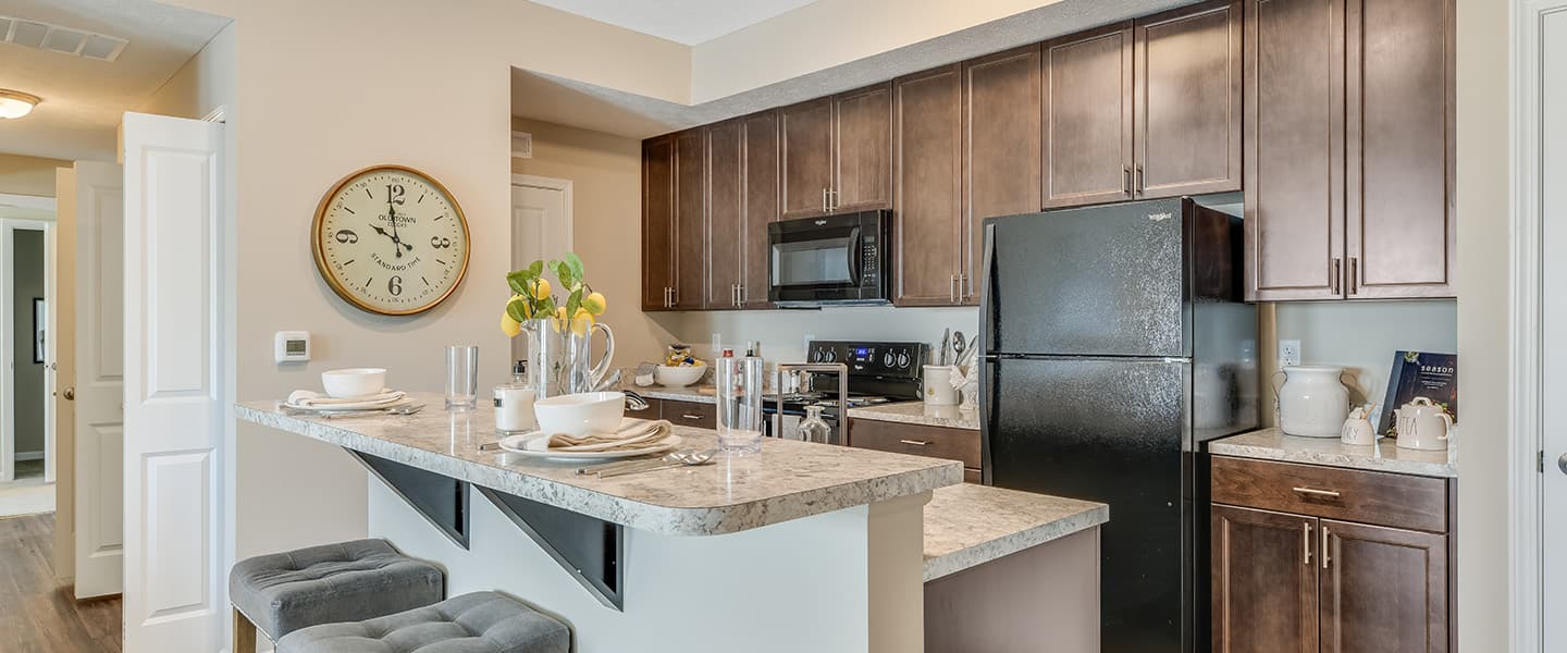 An open kitchen layout complete with updated appliances and modern decor.