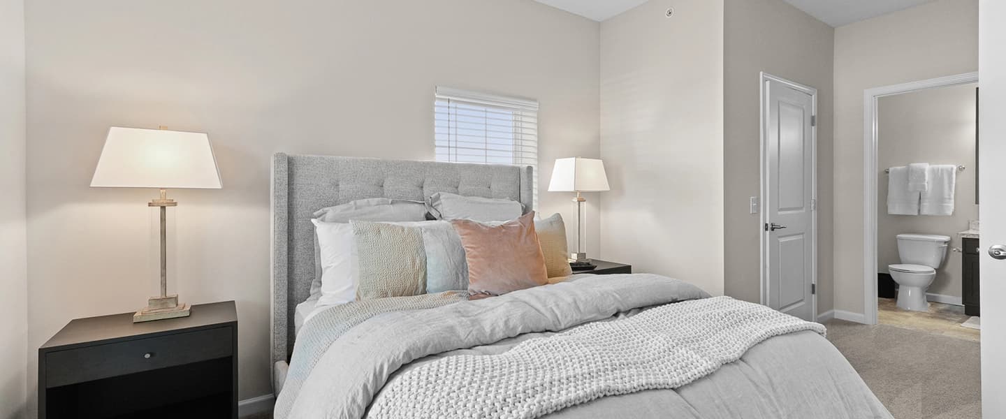 Spacious bedroom with visible access to the connected bathroom