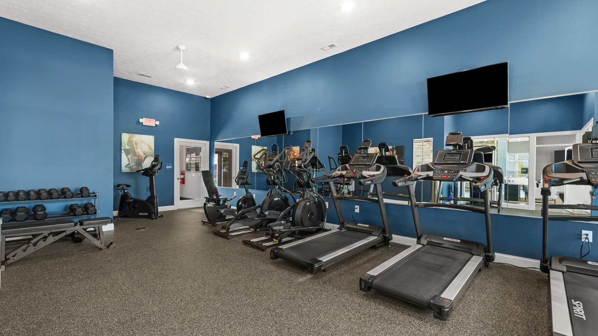 Fitness center with treadmills and weights for use by residents of an Etna Ohio apartment community
