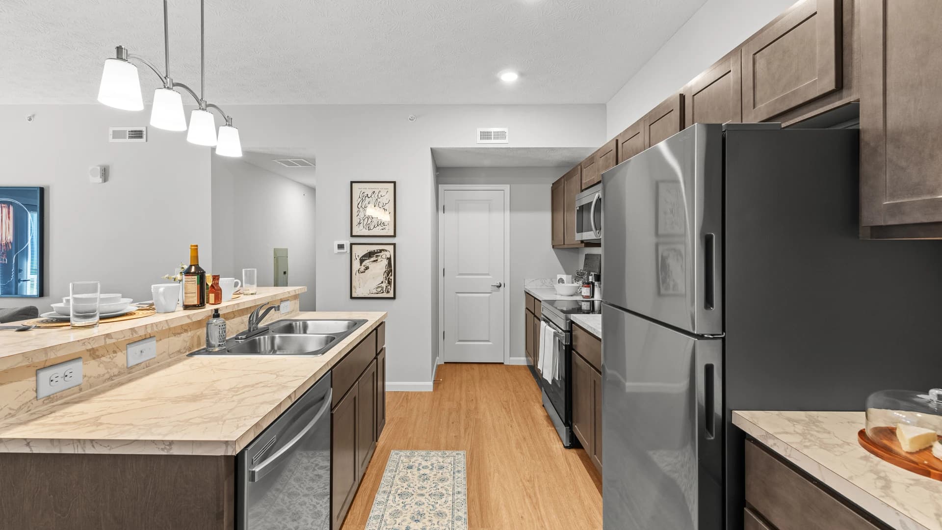 Modern kitchen of an Etna Ohio apartment unit with an island and new appliances