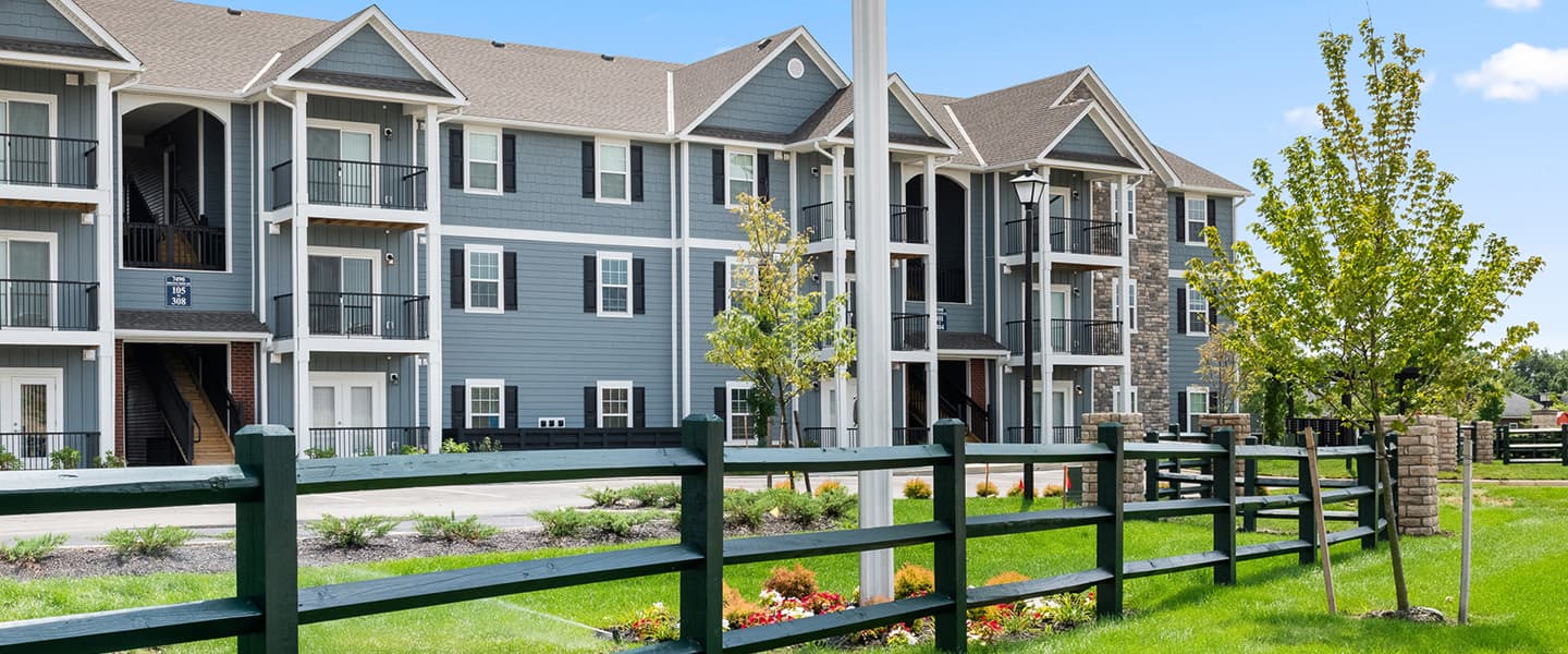Nicely manicured grounds outside a three story Powell Ohio apartment complex