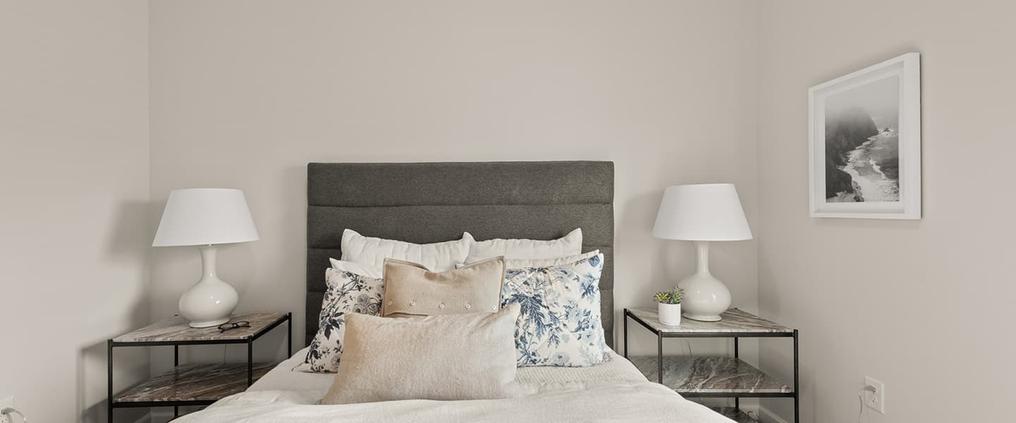 Bed and two nightstands in a Powell Ohio apartment unit