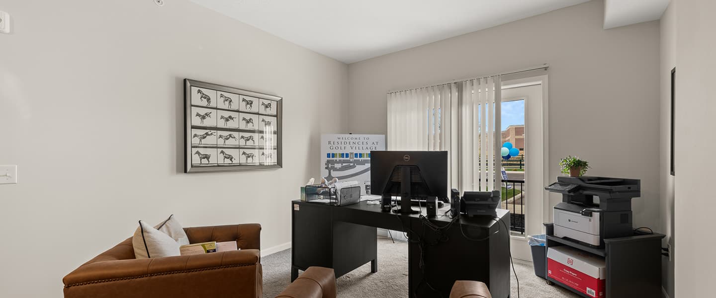 Office area with chairs, desk, printer and computer in a Powell Ohio apartment unit
