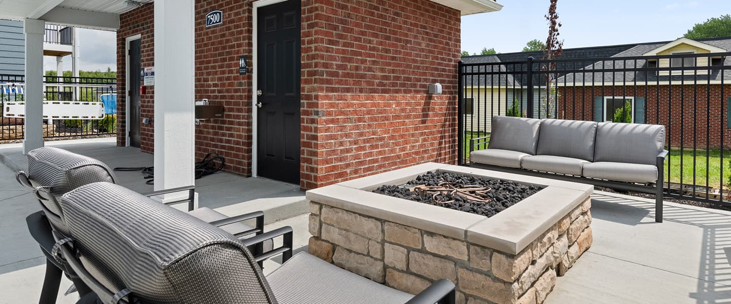 Firepit and comfortable outdoor chairs available for residents of a Powell Ohio apartment complex