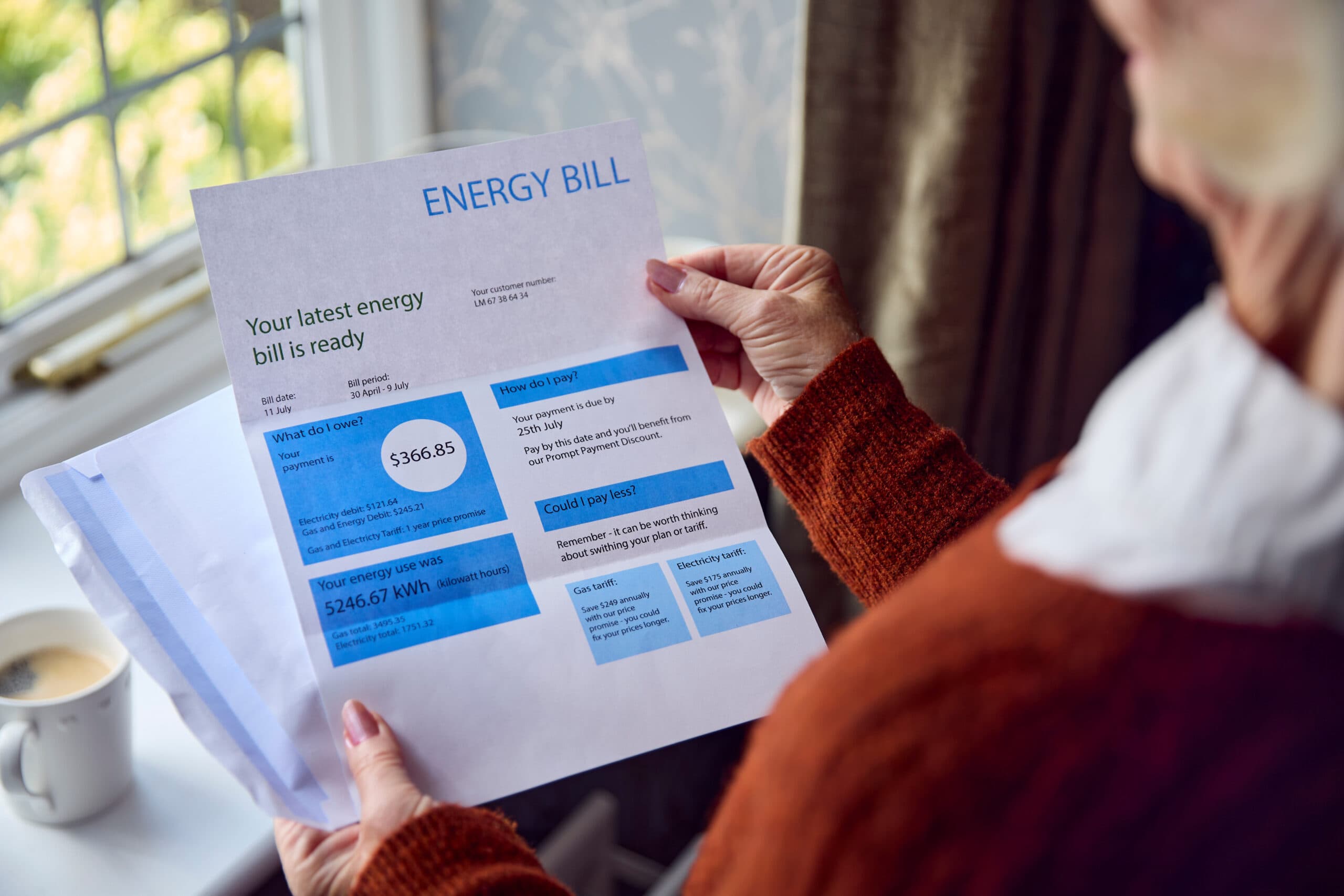 an individual reviewing an energy bill