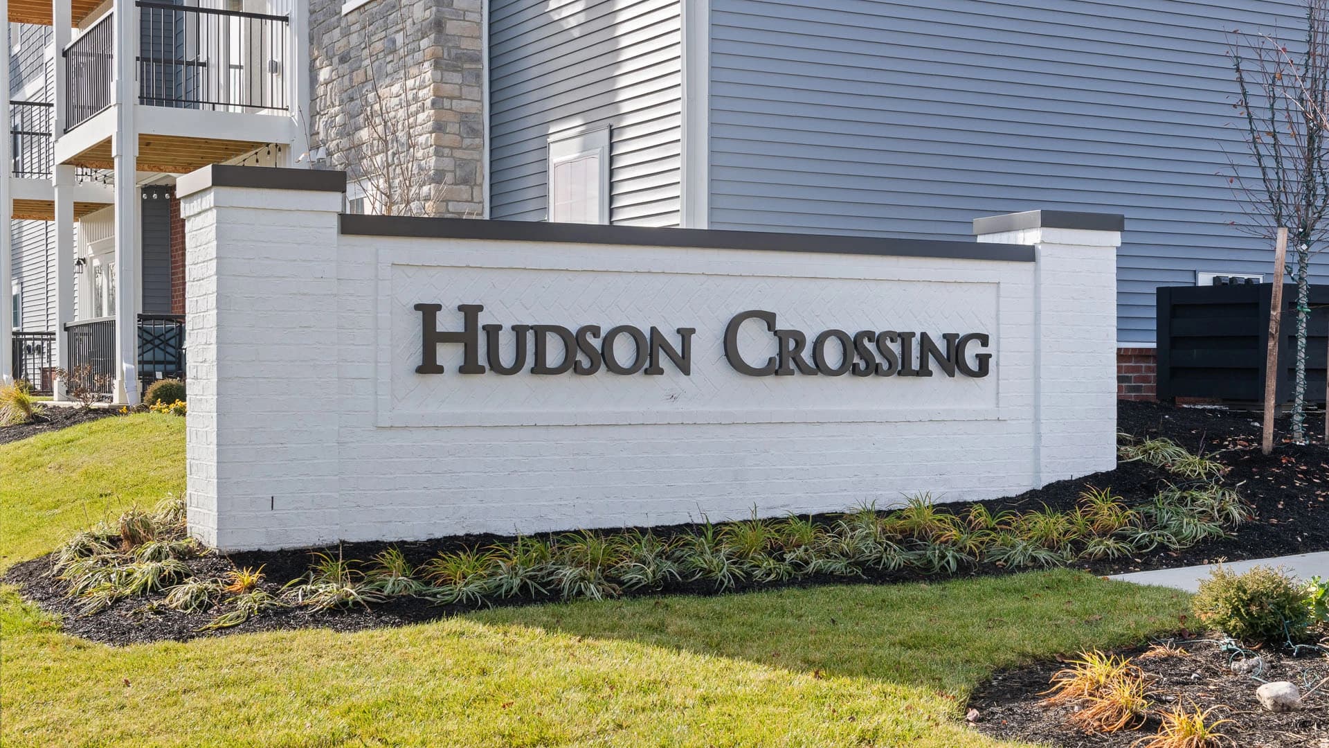Exterior view of sign for Hudson Crossing apartments in Grove City, Ohio