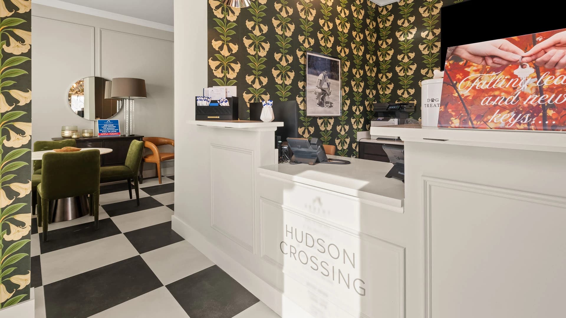 Lobby area with front desk at Hudson Crossing apartment community in Grove City Ohio