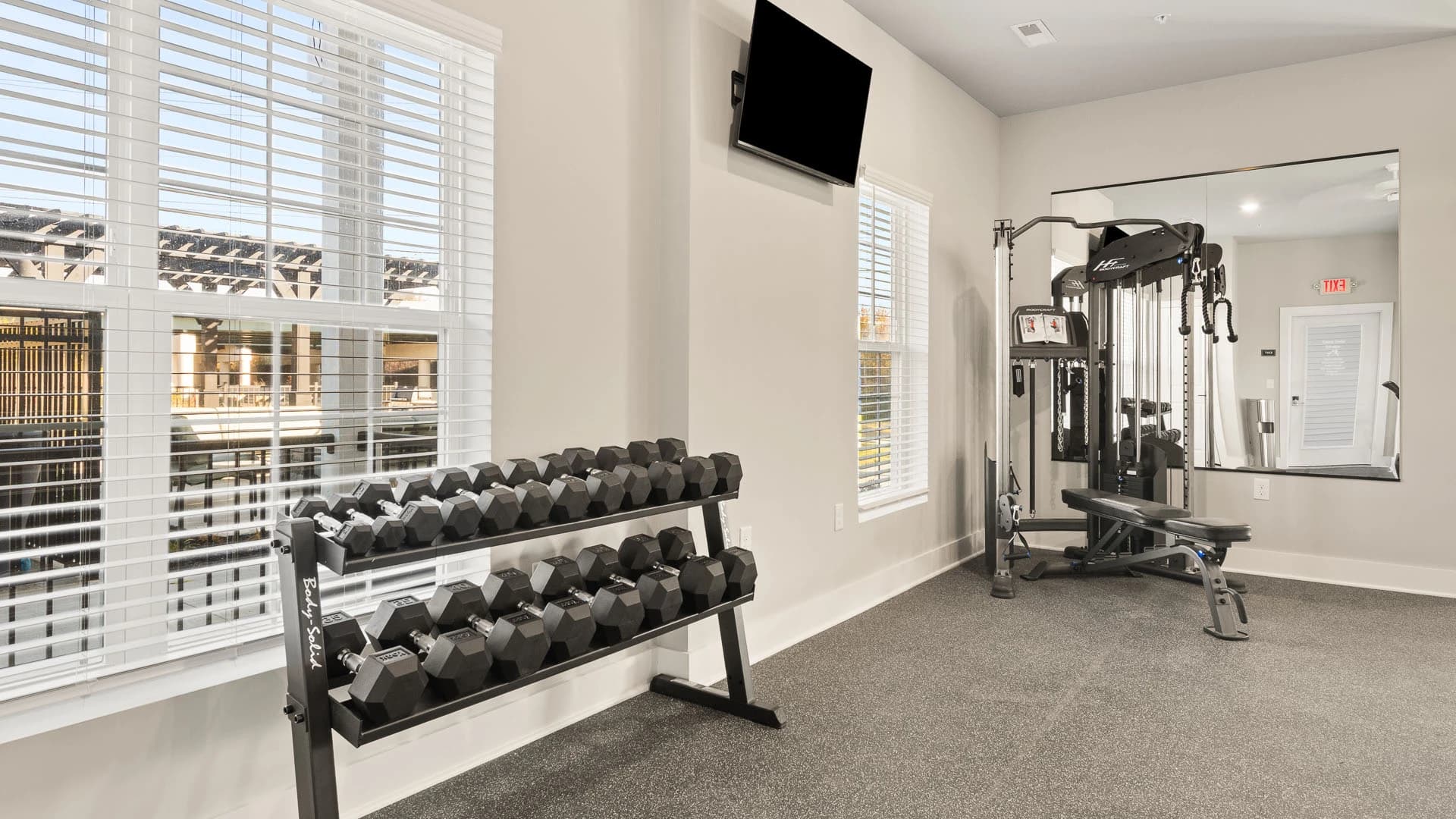 Fitness center with weights and workout equipment available for use by residents of a Grove City Ohio apartment community