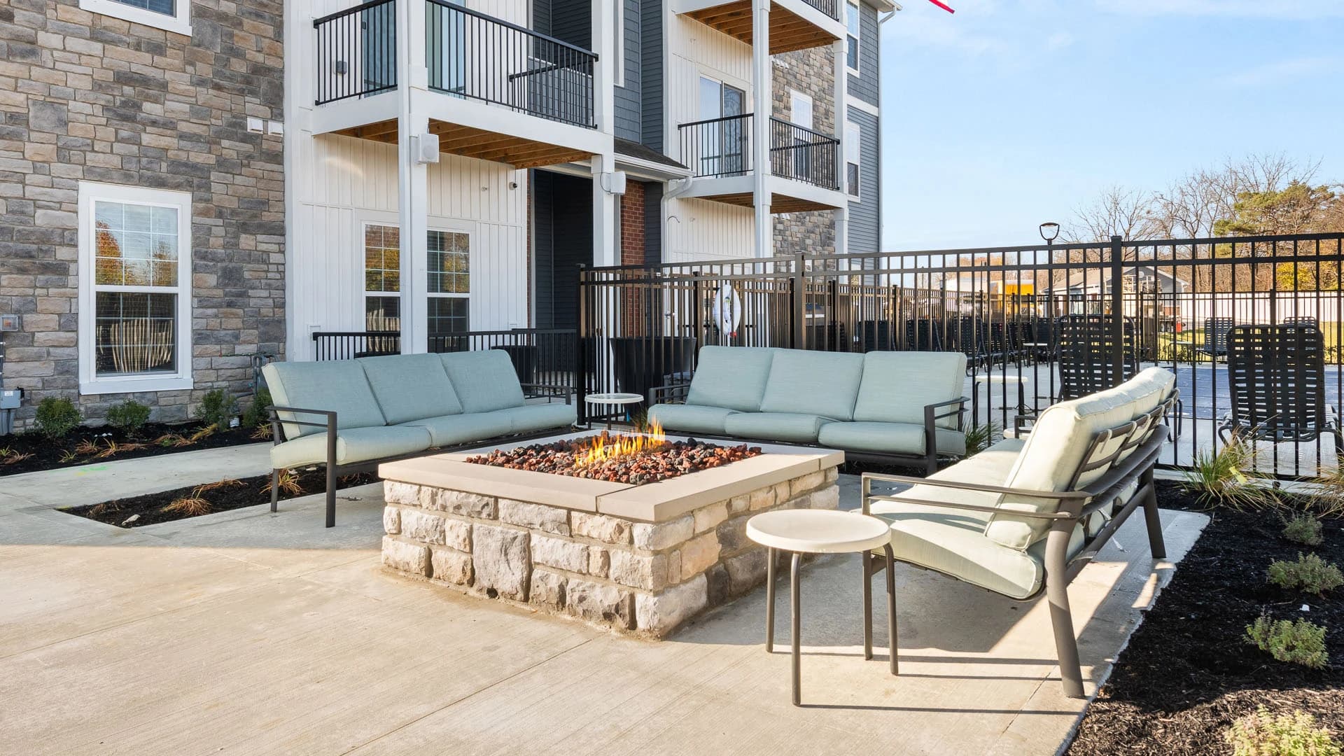 Firepit and outdoor sofas for use by residents of a Grove City apartment complex