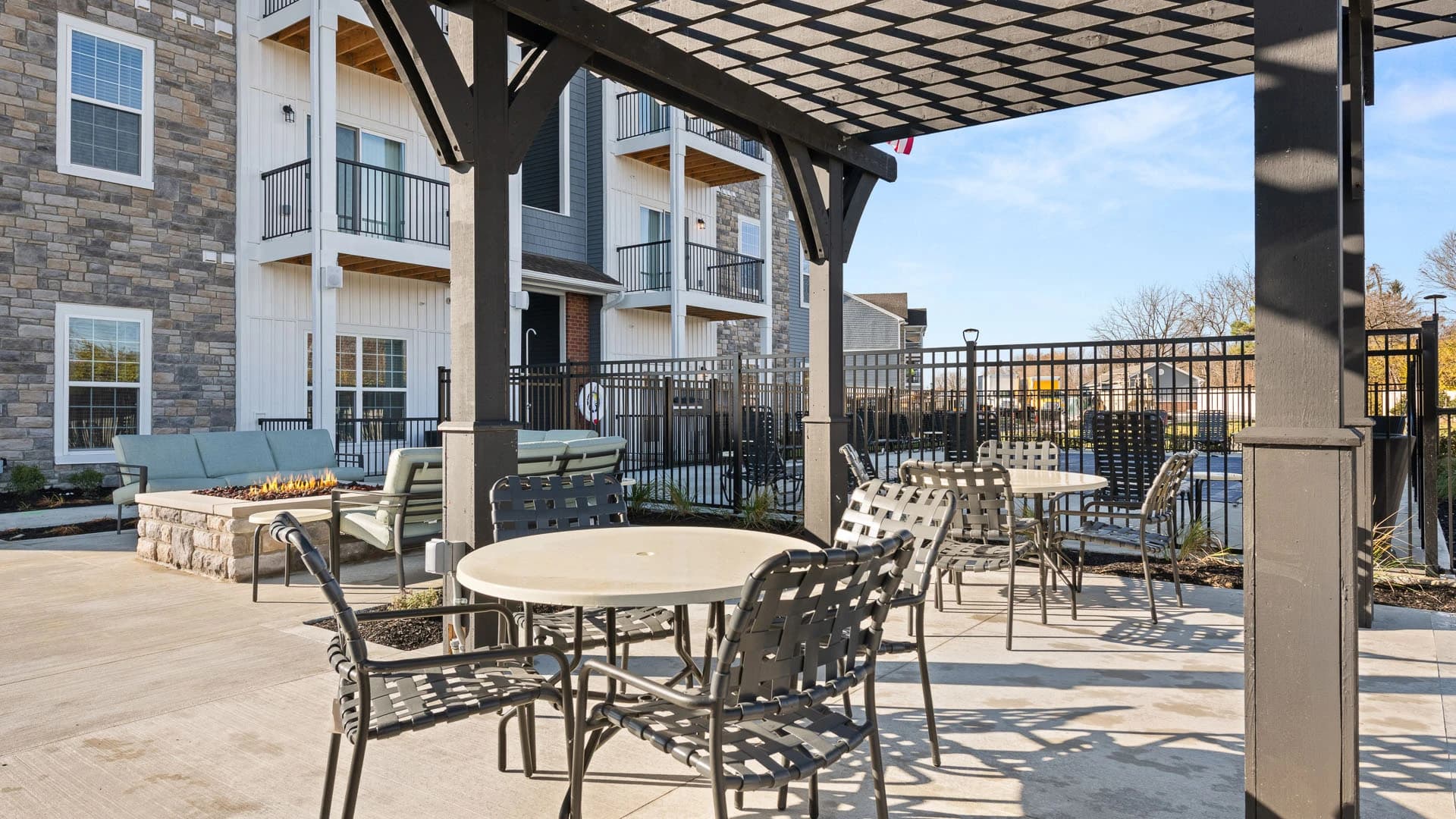 Outdoor patio area with tables and a gazebo for use by residents of a Grove City Ohio apartment community