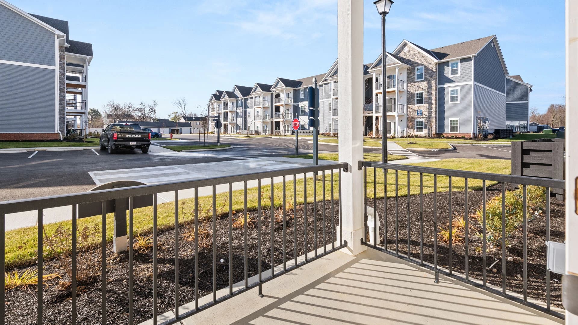 Exterior view from a patio of Hudson Crossing apartment complex buildings in Grove City Ohio