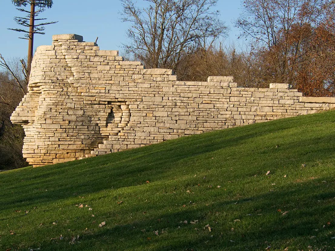 A community park with a brick sculpture.