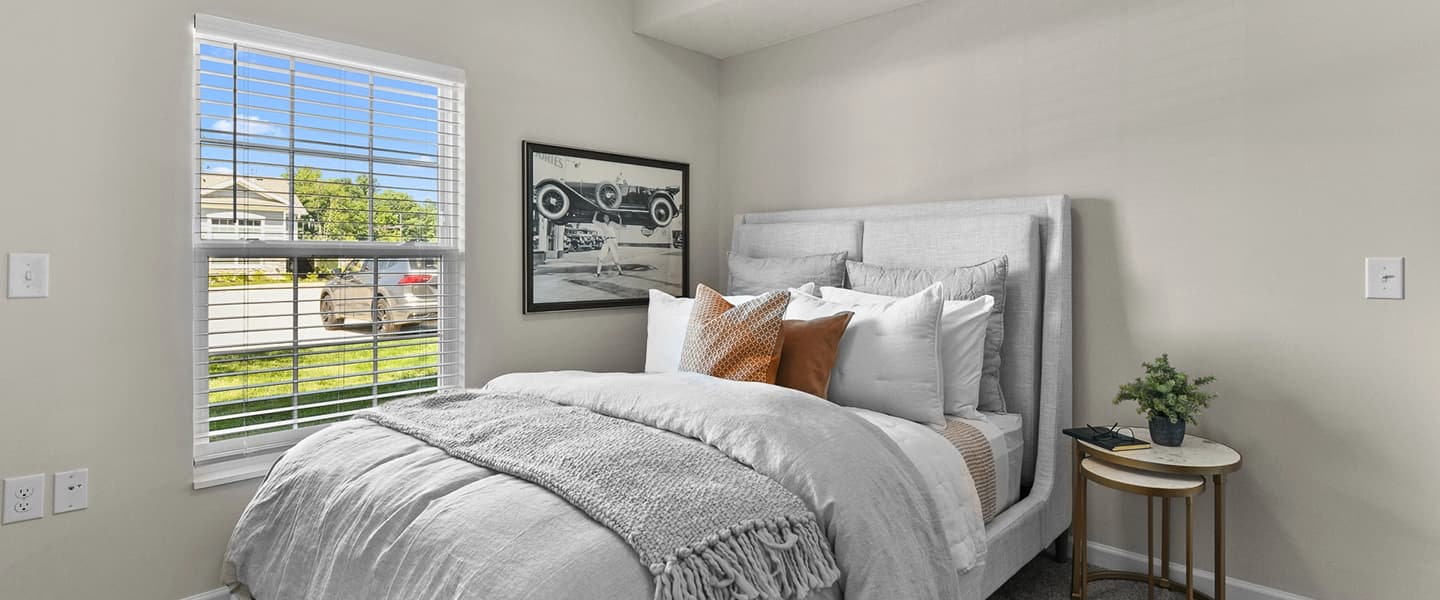 Bedroom with window providing sunlight