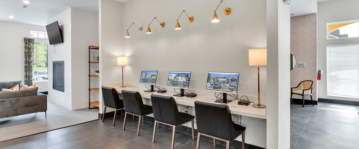 Common space at Woodfield Park with computers and comfortable seating