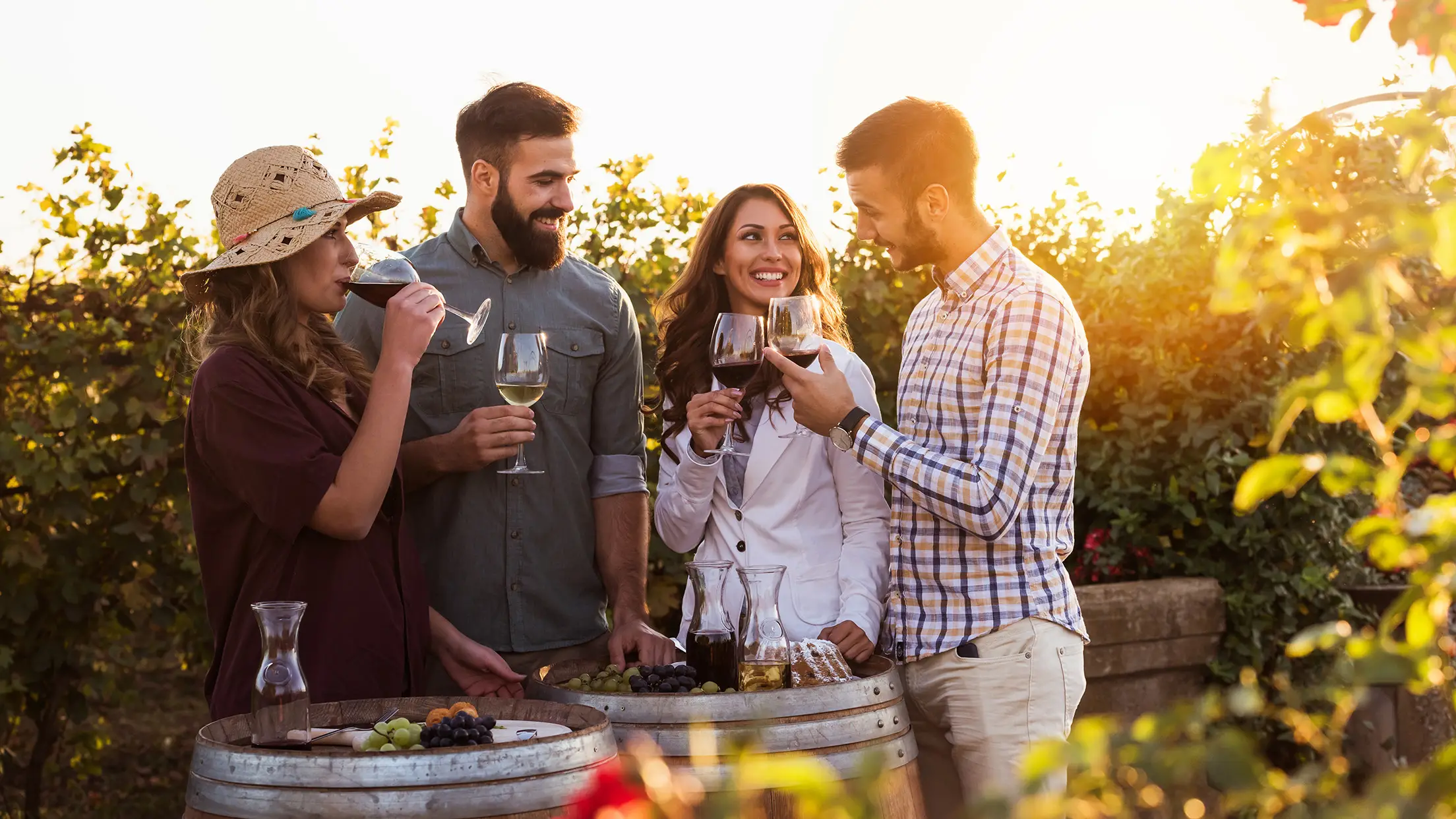 Two couples enjoying a glass of wine.