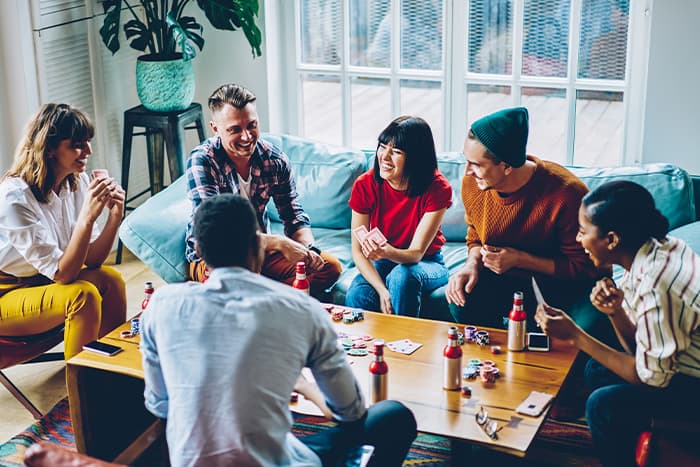 Friends having a game night in an apartment living room